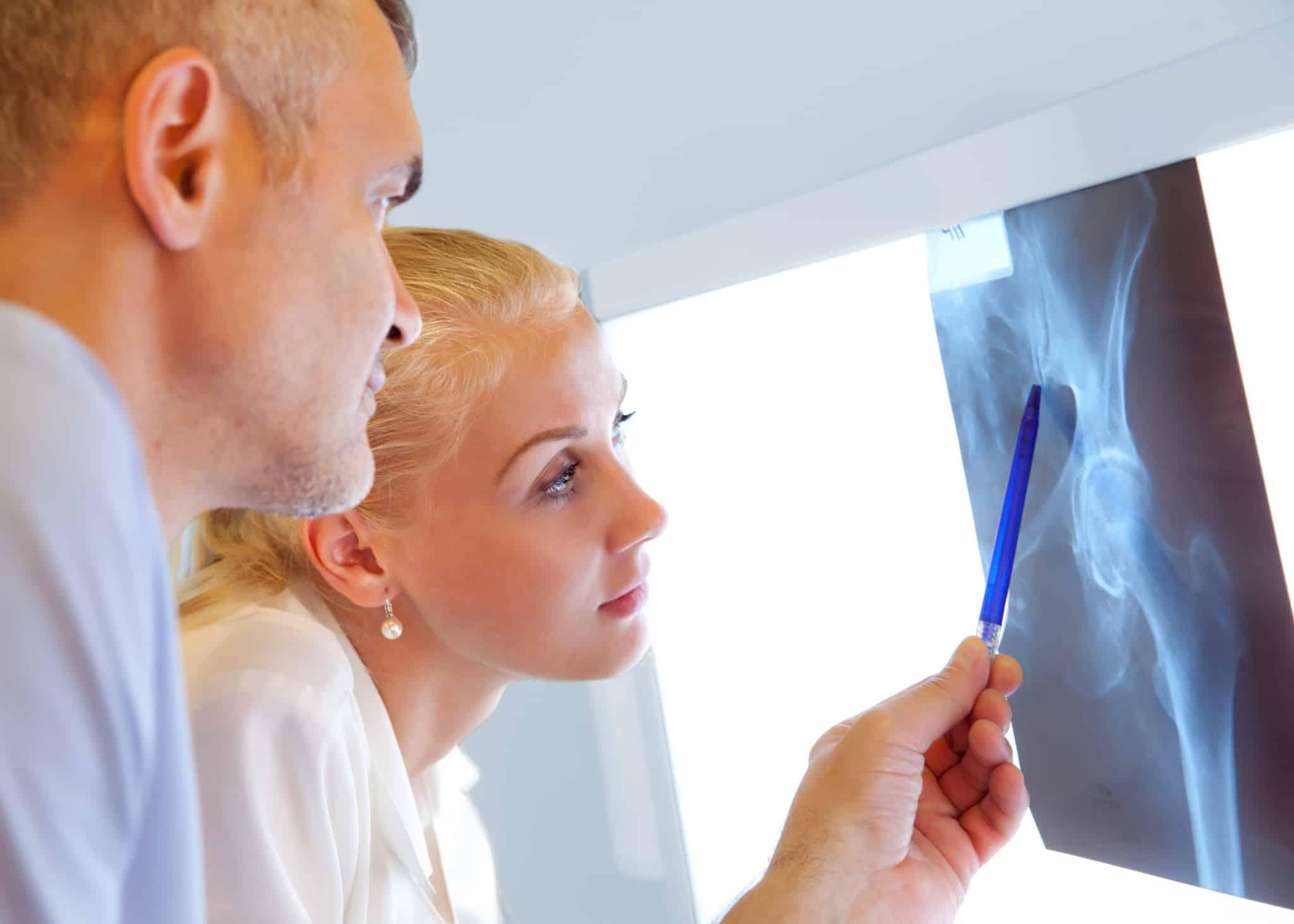 Two Orthopedic Nurse Practitioners Examining X-rays